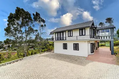 an image of a house with a driveway at Garden Haven 3 BHK Villa with Balcony and Verandah Escape in Kotagiri