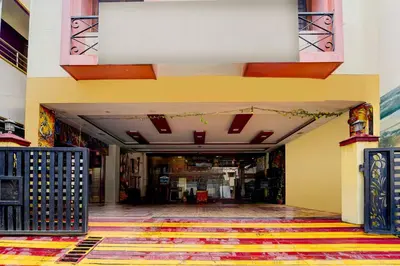 a hallway of a building with a colorful floor at Hotel O Gandhipuram Central Bus Stand in Coimbatore