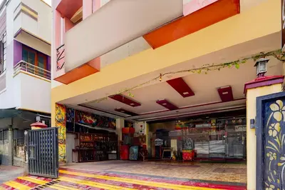 a store front with an open door in a building at Hotel O Gandhipuram Central Bus Stand in Coimbatore