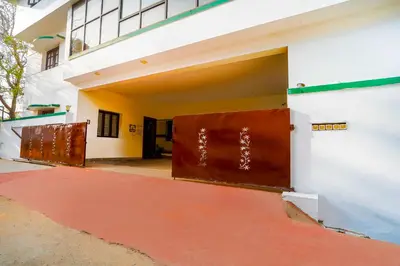 an open door on a building with a red floor at Collection O Singanallur Coimbatore in Coimbatore