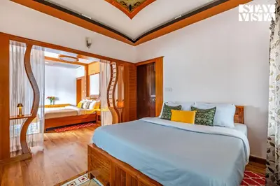 a bedroom with a large bed and a window at The Secret Glen by VEO - Part of StayVista with BBQ & Bonfire in Ooty