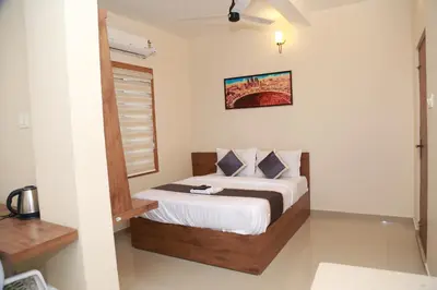 a bedroom with a bed in a room at Haaz Grande Kunnamangalam in Kunnamangalam