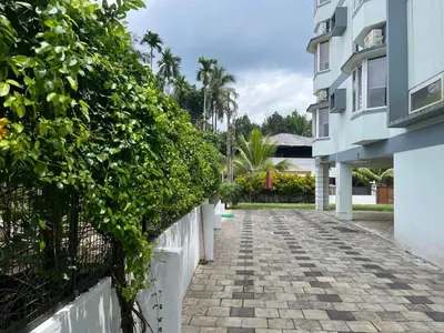 a stone walkway in front of a building at Enhance Lifestyle Service Apartments in Thamarassery