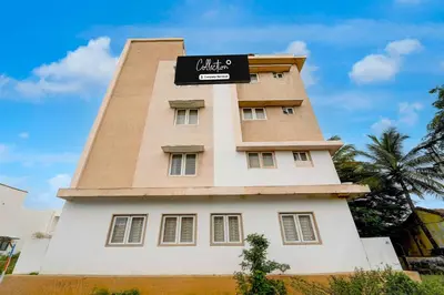 a building with a sign on top of it at Collection O Coimbatore Post Office Ondipudur in Coimbatore