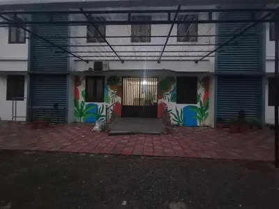 a front door of a building with graffiti on it at bohom STAYORA in Nedumbassery