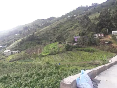 a view of a hill with houses on it at Zirku Garden Kodaikanal in Kodaikānāl