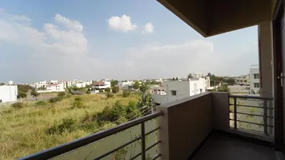 a balcony with a view of a city at Honey Residency Codissia stay in Coimbatore