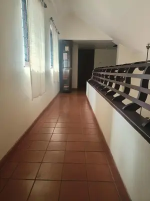 a corridor of a room with at Utthara Tharavadu in Irinjālakuda