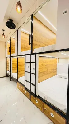 a group of bunk beds in a room at LF Hotels in Kozhikode