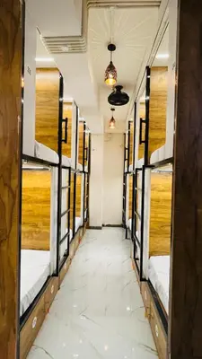 a row of bunk beds in a room at LF Hotels in Kozhikode
