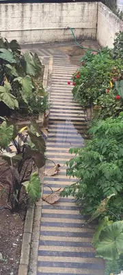 a stone walk way with plants on it at HILL view ooty HOME Stay in Coimbatore