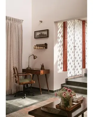 an office with a desk and a chair and a table at Hillside Home 3 BHK Villa by tisyastays in Yedapalli