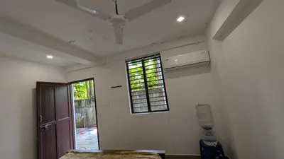 a room with a window and a bed in it at village stay Chittur Thathamangalam in Tattamangalam