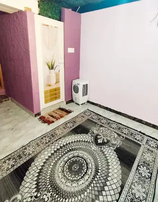 a room with a tile floor and a bathroom with a shower at Mysore City Vibe By A1k in Mysore