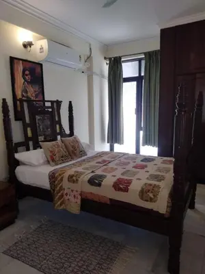 a bedroom with a bed and a window at 3 BHK Flat for rent at Mysuru in Mysore