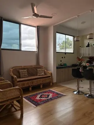 a living room with a couch and a table at SKYRIN Bliss in Mysore