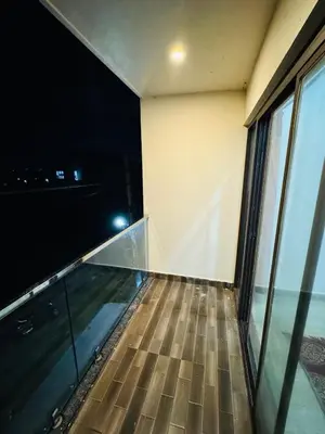 a room with a glass floor with a view of the ocean at LUXE Premium Service Appartment in Mysore