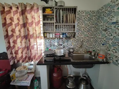 a kitchen with a sink and a counter top at Mountain View Stay in Kushālnagar