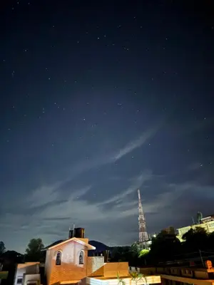 a view of the eiffel tower at night at JMS Holiday homes in Coonoor