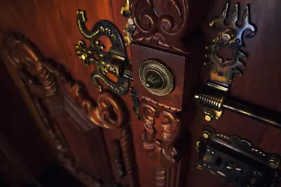 a wooden door with a clock on it at Wood Clusters in Suntikoppa