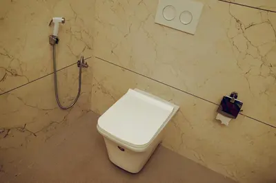 a bathroom with a toilet and a shower at Wood Clusters in Suntikoppa