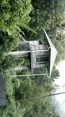 an overhead view of a building in the trees at AppleLand City Athirapilly by Hotels Cart in Athirappally