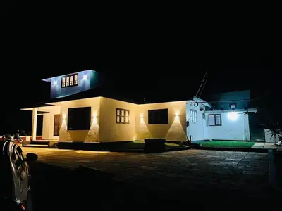 a house at night with its lights on at The Soul 1 Service Villa in Mananthavady