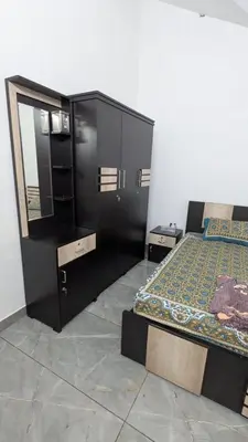a bedroom with two beds and a mirror at The Soul 1 Service Villa in Mananthavady