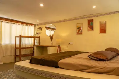 a bedroom with a large bed in a room at Nirvana 'By the lake' in Kūkkāl