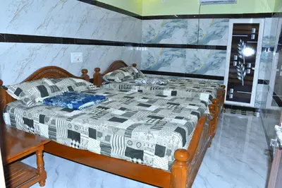 a bed in a room with a marble wall at CS RESORT River point in Wodapatti
