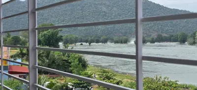 a view of a river from a window at CS RESORT River point in Wodapatti
