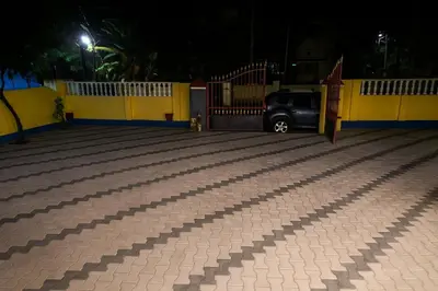 a car parked in a parking lot at night at Guruvayur Agraharam Homestay in Guruvāyūr