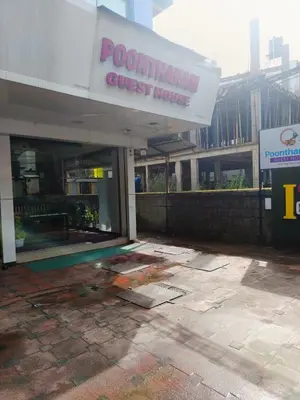 a front of a building with a guest house at Poonthanam guest house in Guruvāyūr