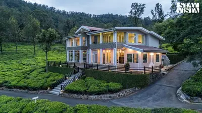 a home in the middle of a field at StayVista at Sande's Farview with Bonfire in Coonoor