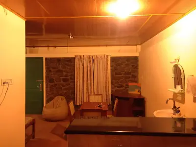 a room with a bathroom with a sink and a sink at Lone Tree Creek in Vattavada