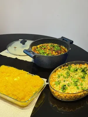 a table with two dishes of food on a table at Seawind in Kannur