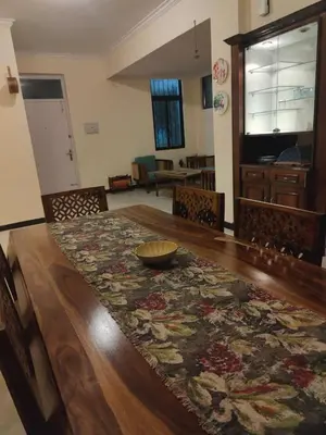 a dining room table with a bowl on top of it at Thambaratty in Mysore