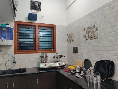 a kitchen with a sink and a counter top at Kamadhenu Homestay, Comapact 2BHK OPP Mysore zoo, A in Mysore