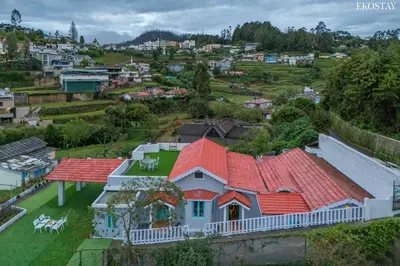 an aerial view of a house with red roofs at EKOSTAY - Casa Del Sol in Ooty
