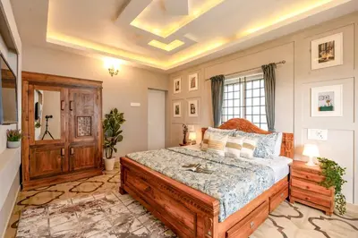 a bedroom with a large bed in a room at EKOSTAY - Garden Grove Villa in Ooty