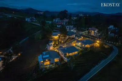 an aerial view of a house at night at EKOSTAY - Skyfall Mist Villa in Ooty