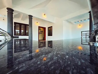 a lobby of a building with a floor of water at Tranquil Nest Villa - 4BHK Villa - Entire Villa stay in Wayanad in Kalpetta