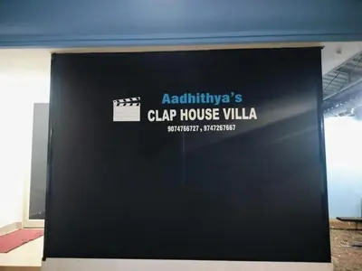 a black door with the words clap house villa on it at Clap House Home in Guruvāyūr