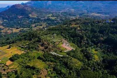 an aerial view of a village on a mountain at Munnar Mountain view cottage in Munnar