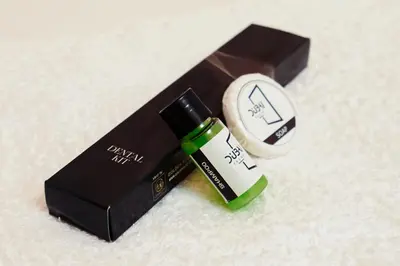 a black box with a tube of lipstick and a bottle of soap at Dubai Frame Residency And Hotel in Thottada