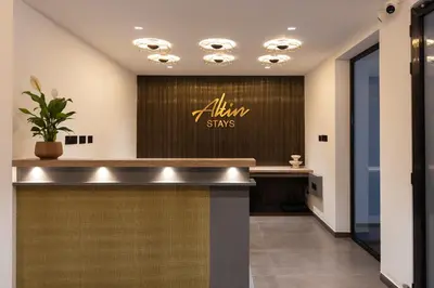 a lobby with aania signs on the wall at Altin Stays in Coimbatore