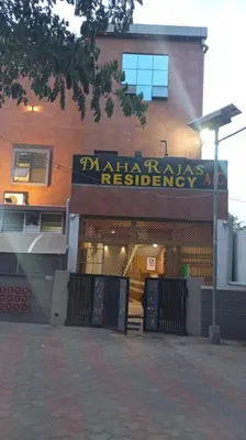 a building with a sign that reads matawan redemptionagency at Hotel Maharajas in Kāmānayakkanpālaiyam