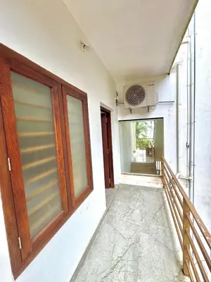 a door on the side of a building at GroveStay in Chakkarakkal