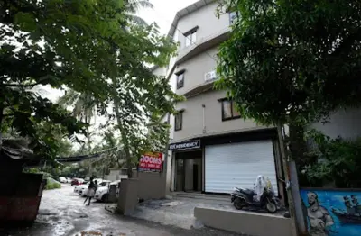 a motorcycle parked in front of a building at RK Residency in Kozhikode