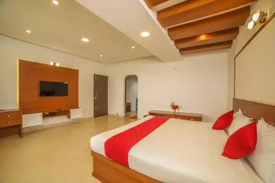 a bedroom with a large bed and a flat screen tv at Heavenly Hills 4 BHK Villa - 1 Bedroom in Kotagiri